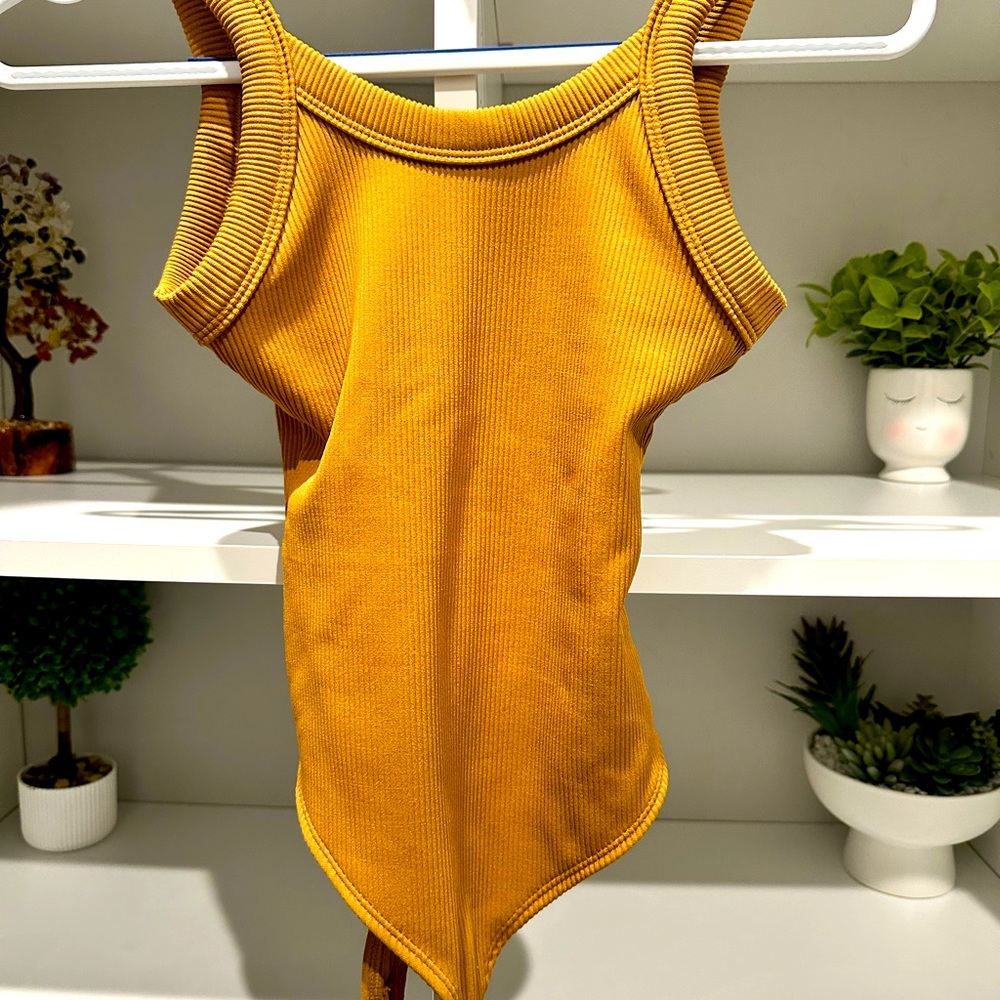 Woman’s tank body suit never used